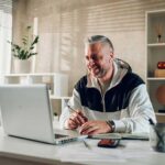Man using a laptop computer at a desk